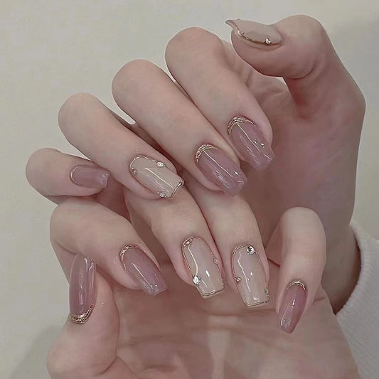 Manicure with nude metal mirror lines on hands
